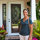 Customer standing next to entry door installed by Pacer Door.