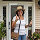 Customer standing next to entry door installed by Pacer Door.