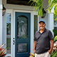 Customer standing next to entry door installed by Pacer Door.