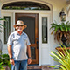 Customer standing next to entry door installed by Pacer Door.