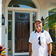 Customer standing next to entry door installed by Pacer Door.