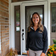 Customer standing next to entry door installed by Pacer Door.